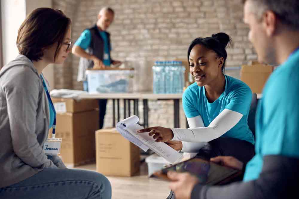 Nonprofit volunteers coordinating grant-funded programs supported by Group 36 grant administration